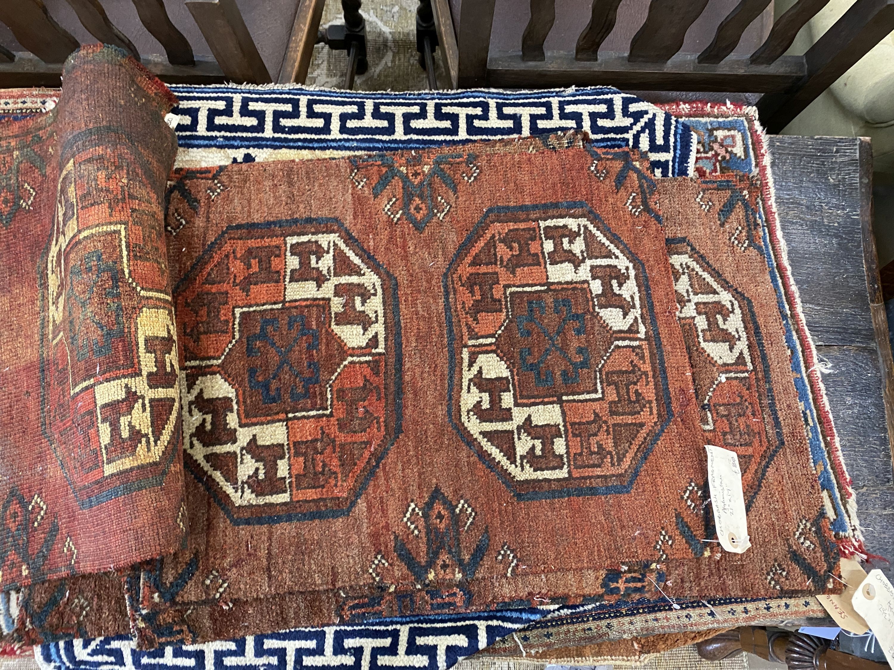 Nine Afghan, Persian and Chinese rug fragments.